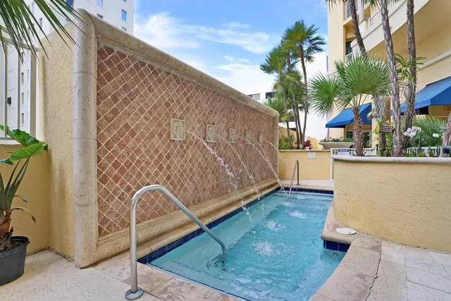 a view of a patio with a table and chairs