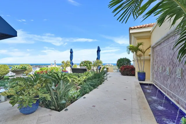 a pathway of a house with a yard