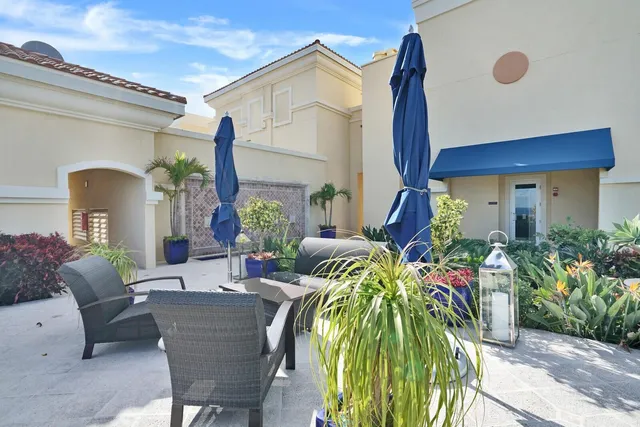a view of balcony with potted plants