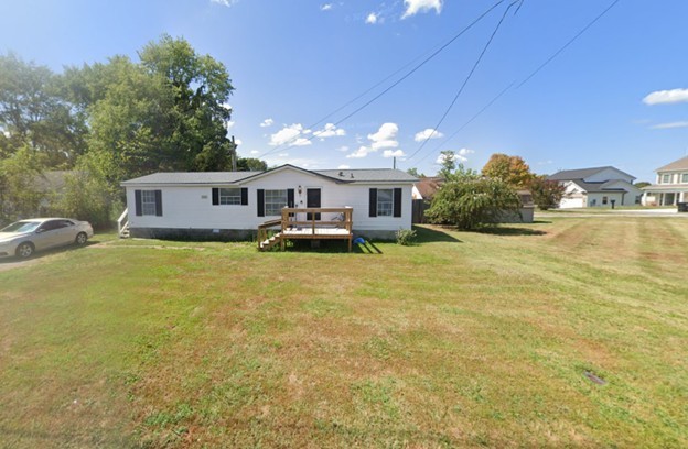 2735 Nunley Street Greenbrier, TN 37073 - Photo 1 of 4 a view of a house with a yard and sitting area
