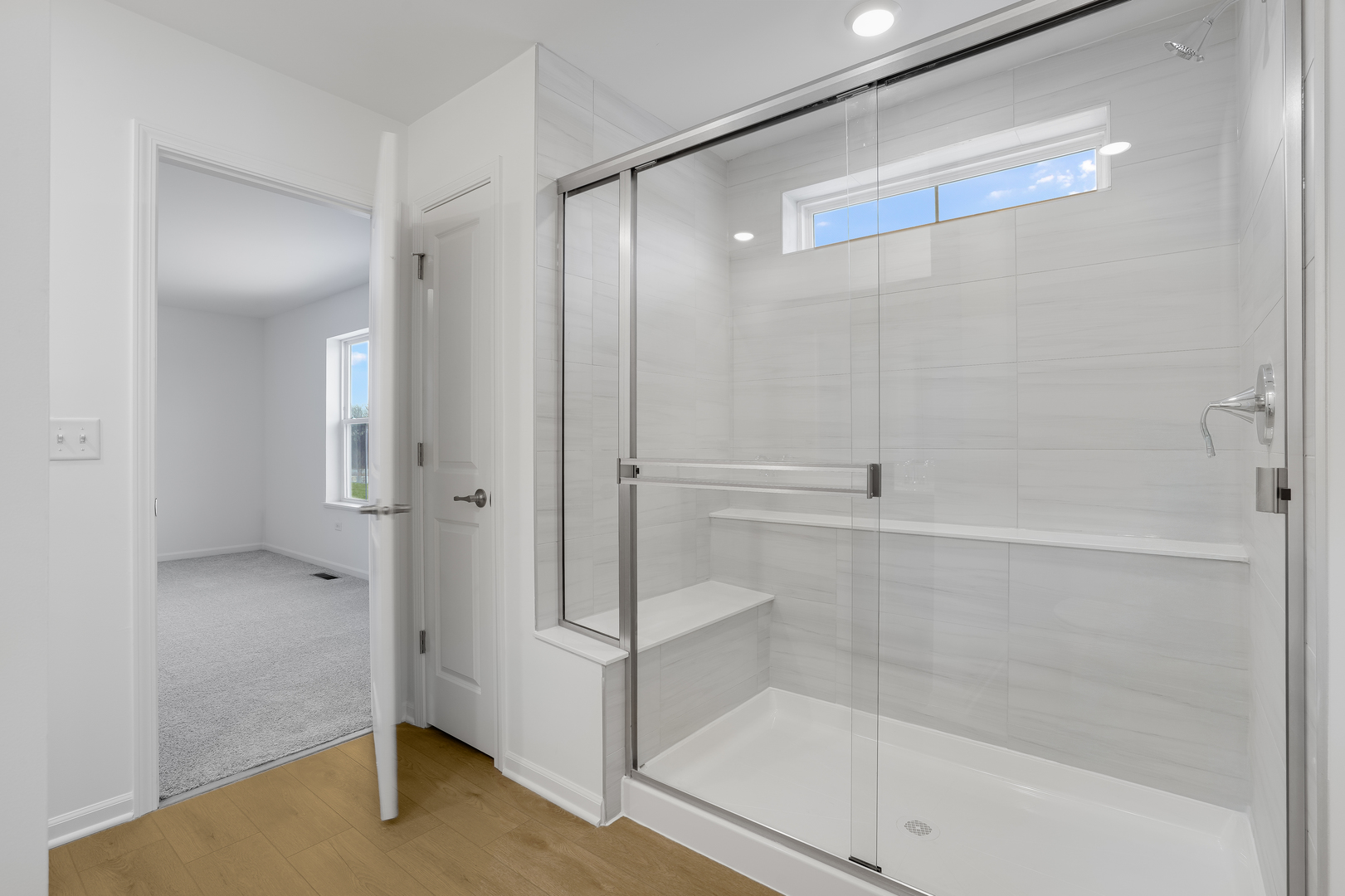 586 Lismore Circle Elgin, IL 60124 - Photo 10 of 35 a bathroom with a bathtub and a glass door