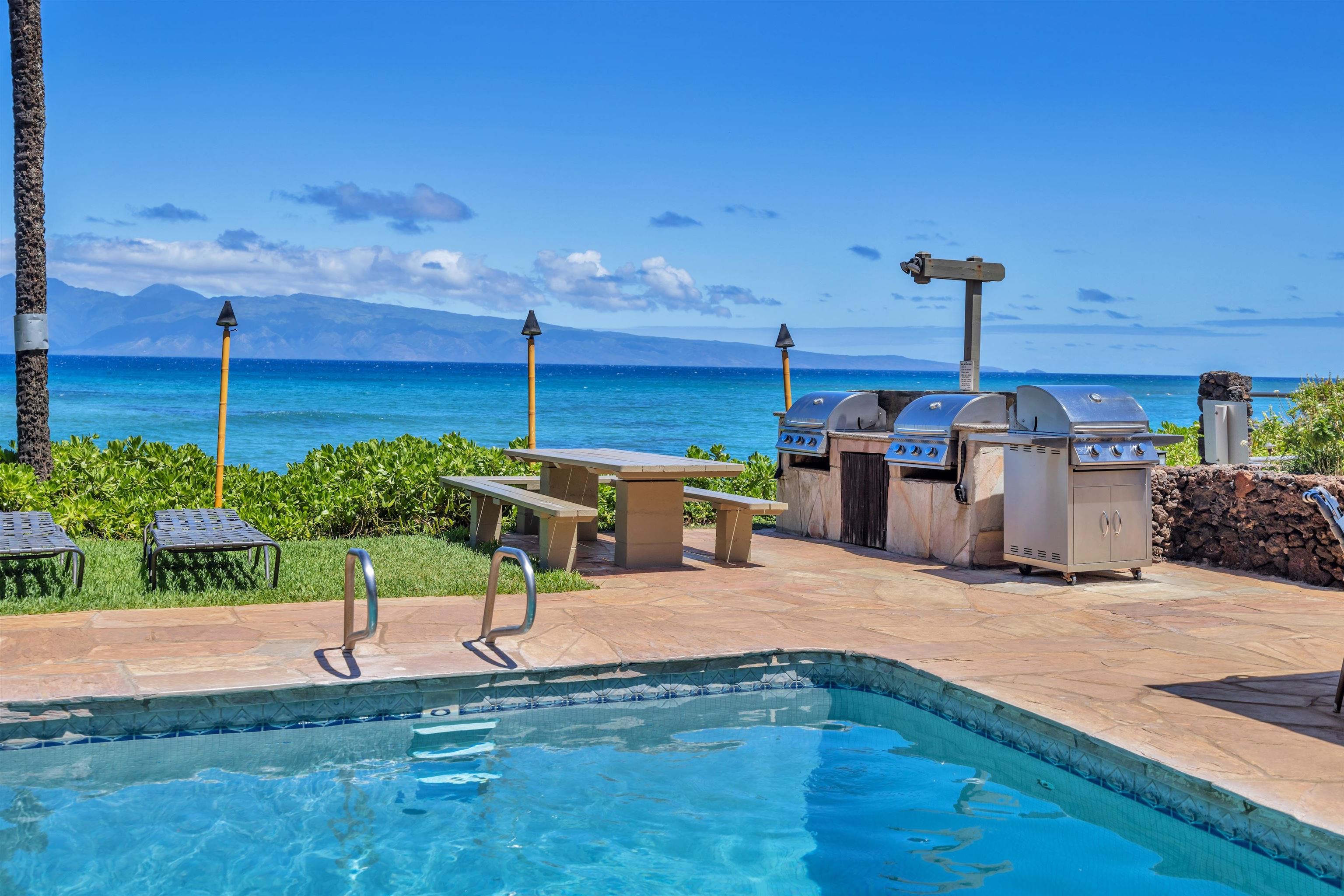 4095 Lower Honoapiilani Road, Unit 114B Lahaina, HI 96761 - Photo 12 of 18 a view of a backyard