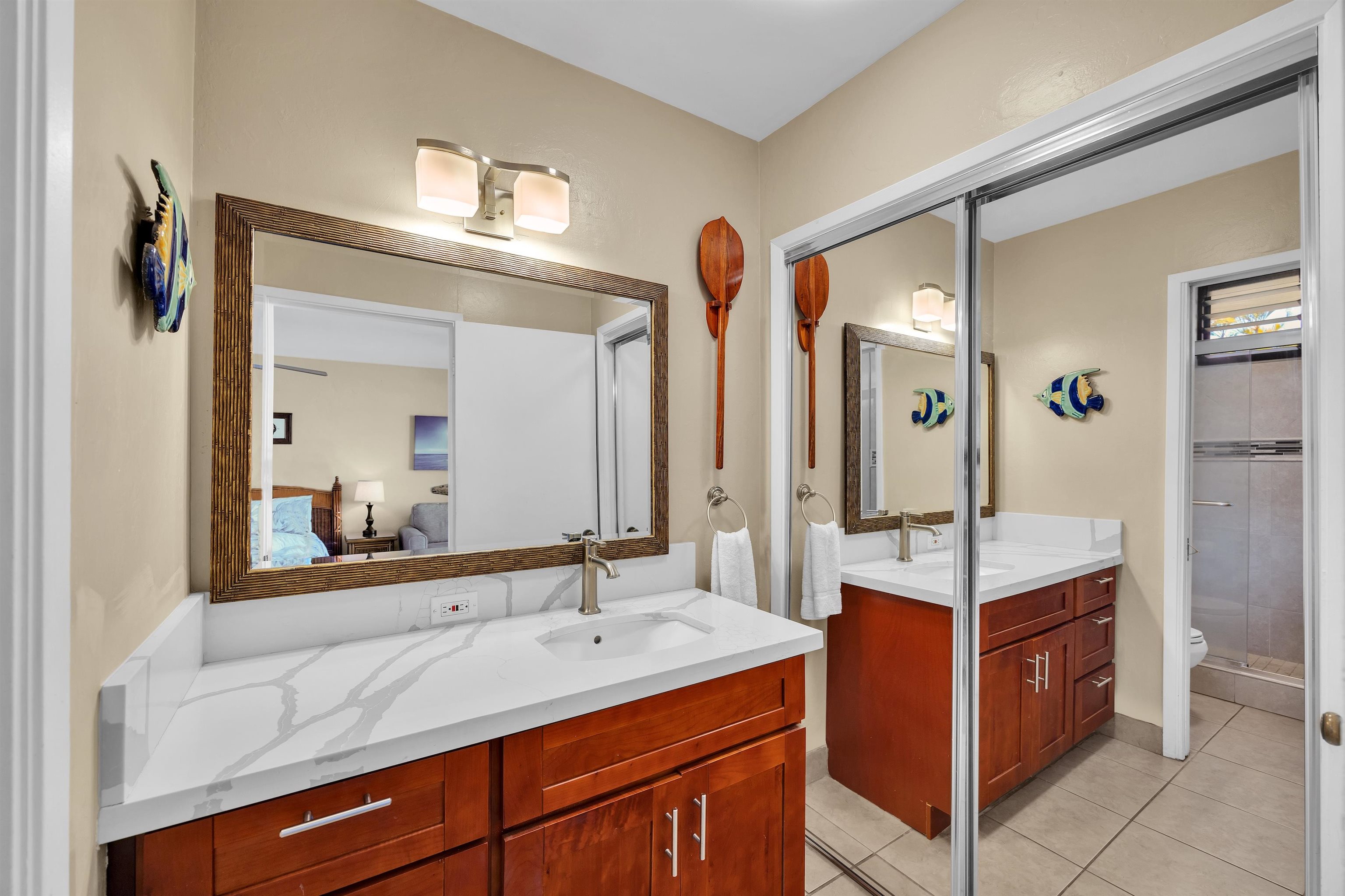 4095 Lower Honoapiilani Road, Unit 114B Lahaina, HI 96761 - Photo 7 of 18 a bathroom with a sink double vanity and a mirror