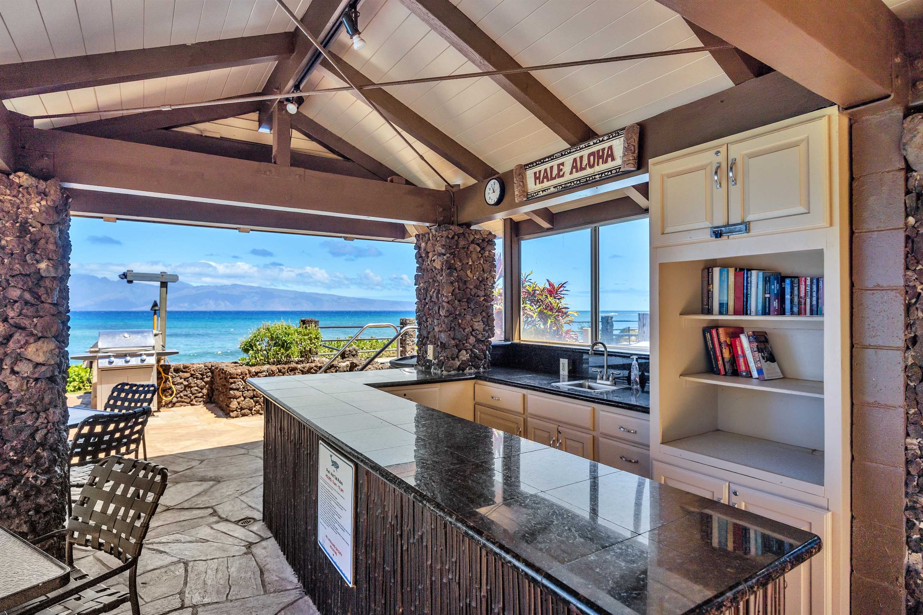 4095 Lower Honoapiilani Road, Unit 114B Lahaina, HI 96761 - Photo 10 of 18 a view of a patio with couches table and chairs