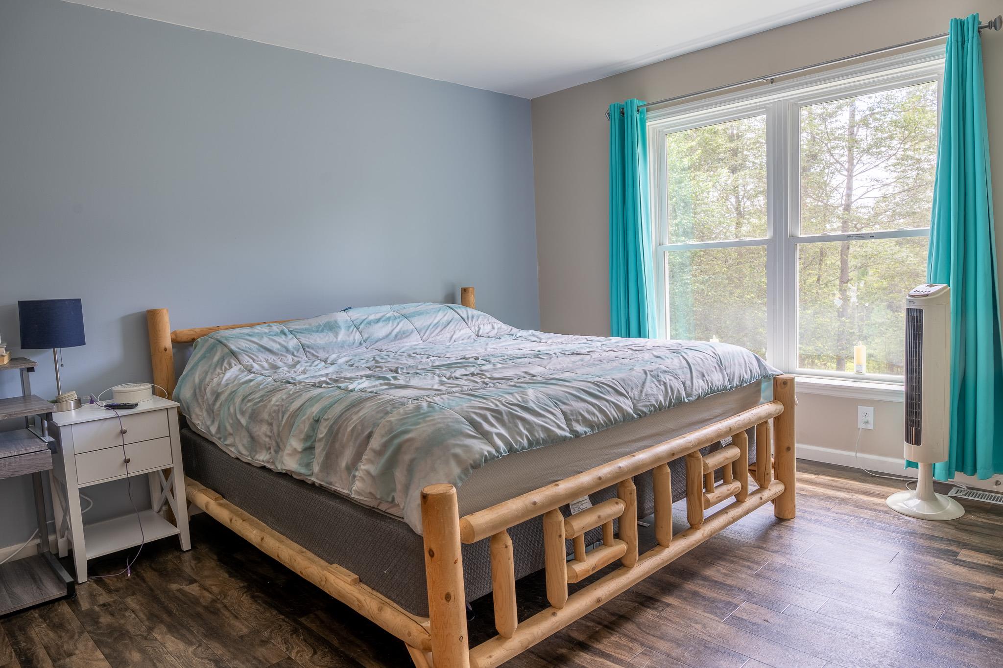 56 Ahrens Road Parksville, NY 12768 - Photo 13 of 23 Bedroom featuring multiple windows and wood finished floors