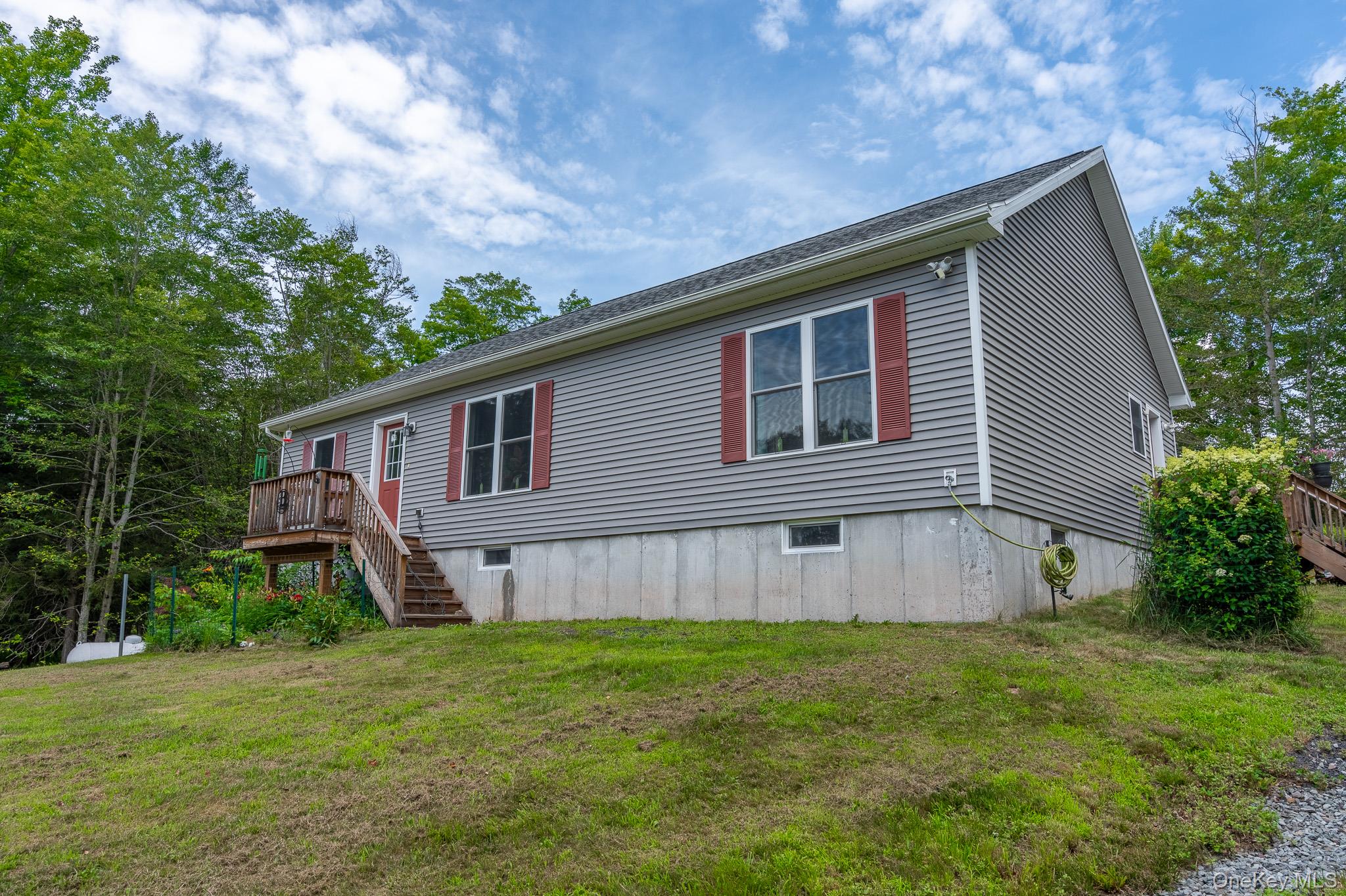 56 Ahrens Road Parksville, NY 12768 - Photo 16 of 23 a view of a house with a yard