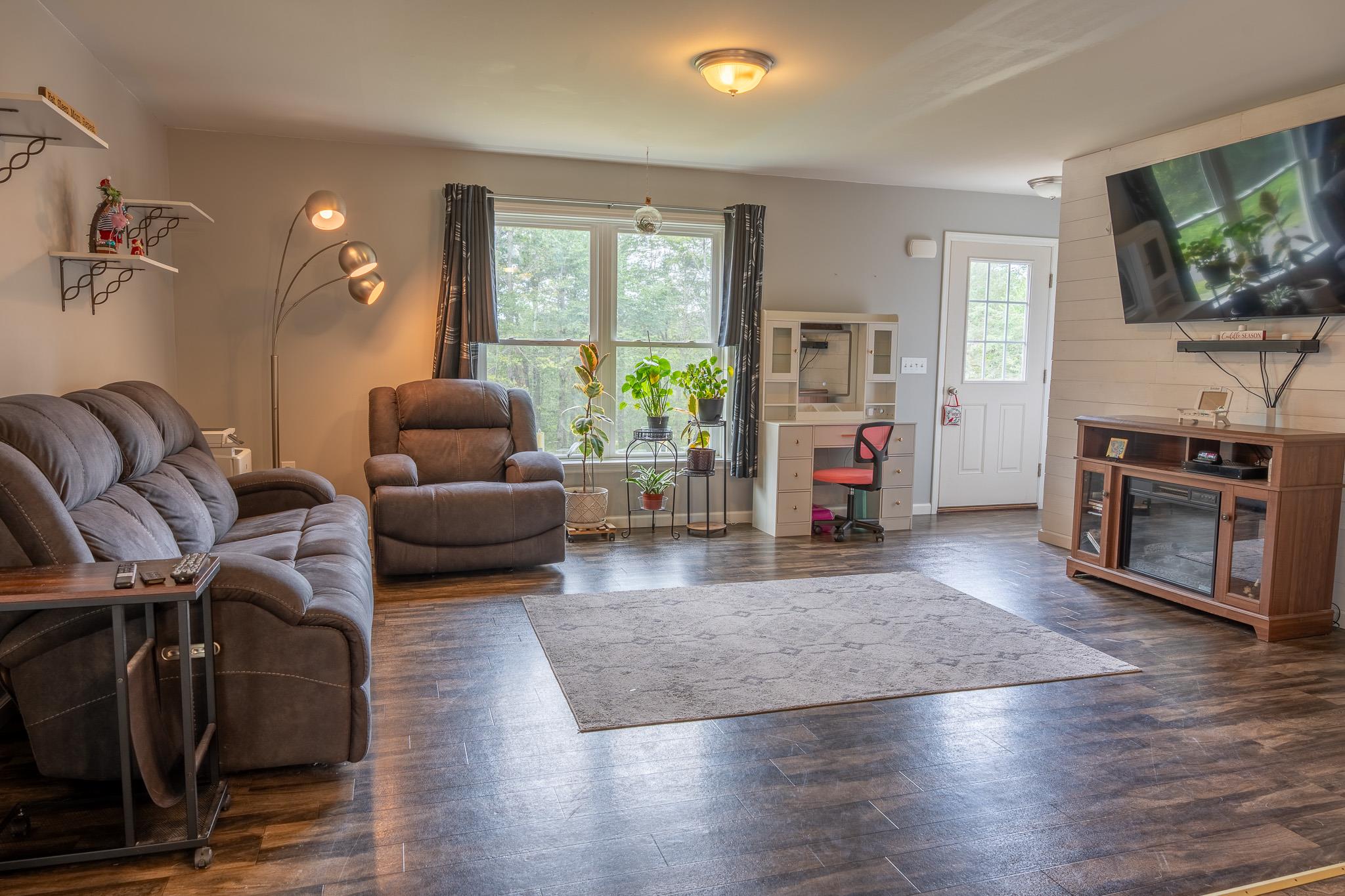 56 Ahrens Road Parksville, NY 12768 - Photo 8 of 23 Living area featuring wood finished floors