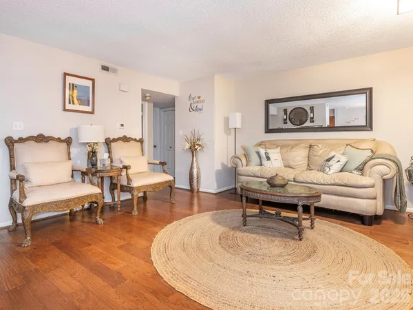 a living room with furniture and a table