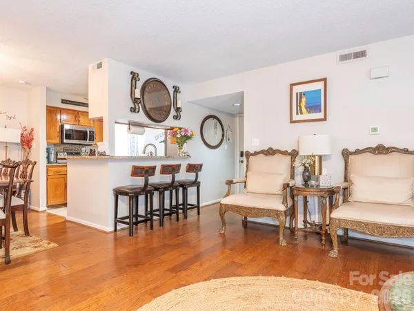 a kitchen with stainless steel appliances granite countertop a stove and a microwave