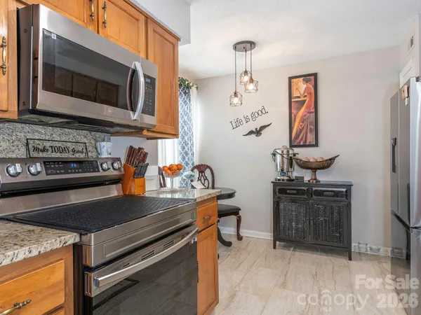 a view of a livingroom with furniture and a window