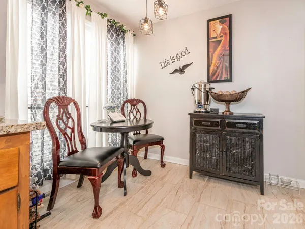 a kitchen with stainless steel appliances granite countertop a stove and cabinets