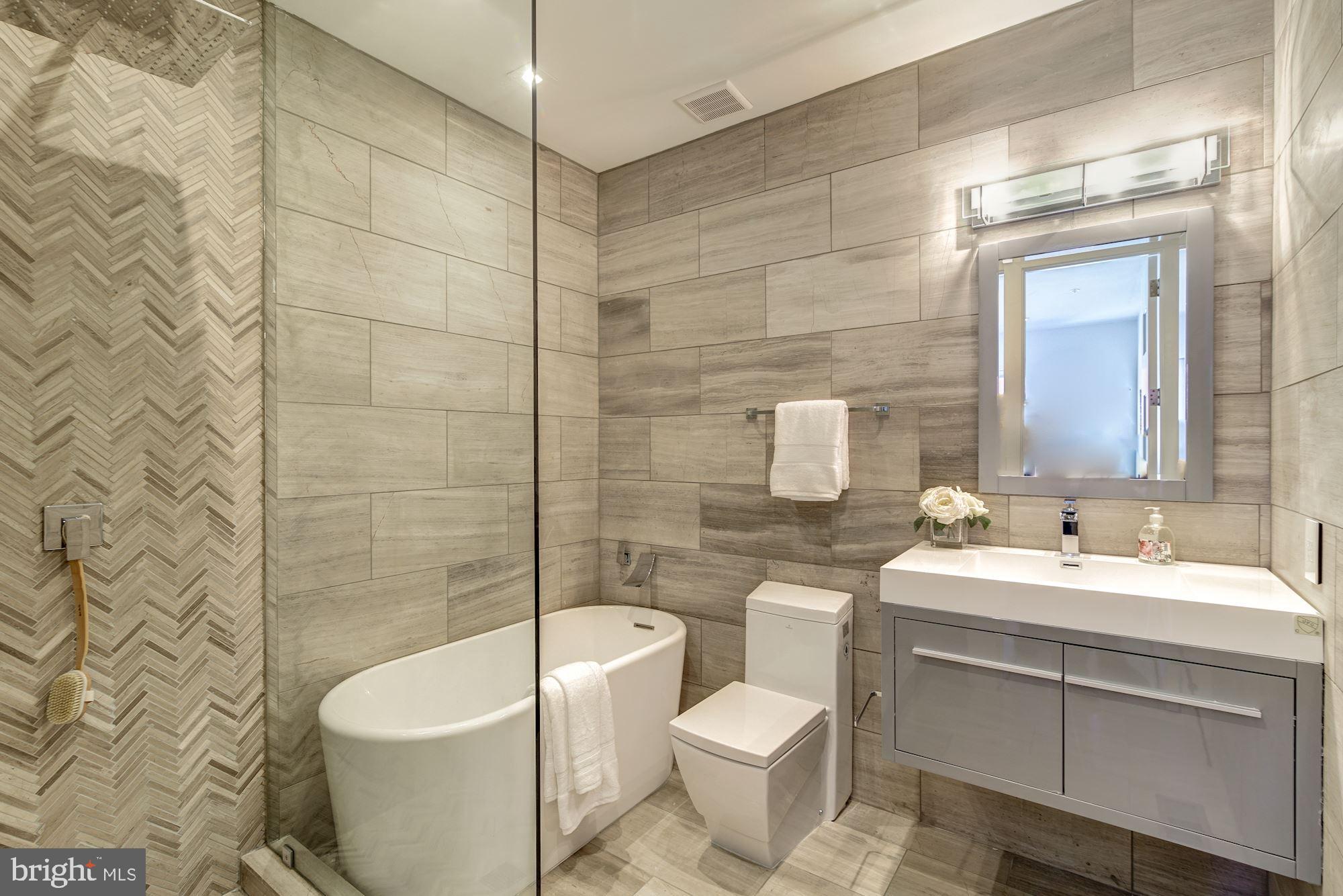 2515 Ontario Road Northwest, Unit 2 Washington, DC 20009 - Photo 24 of 42 Bathroom with marble tiles with ADM bath tub