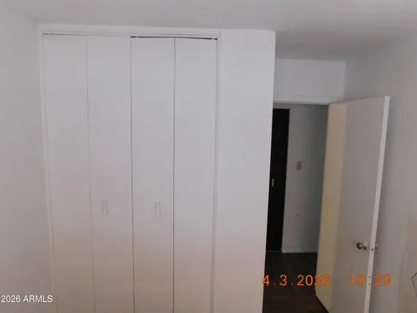 a view of storage and utility room with racks on the wall