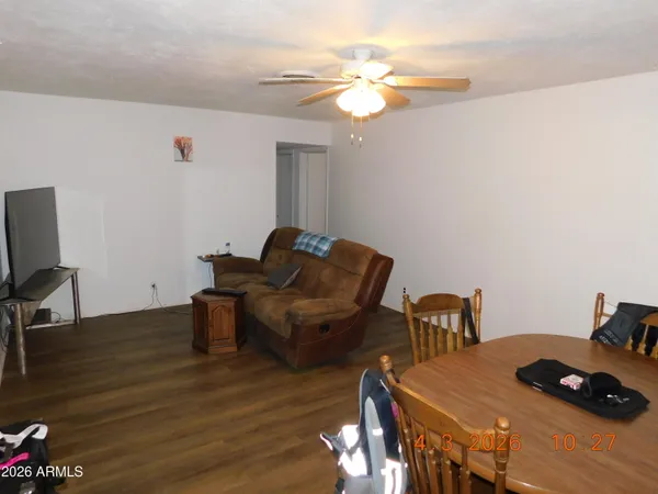 a view of a chairs and table in backyard