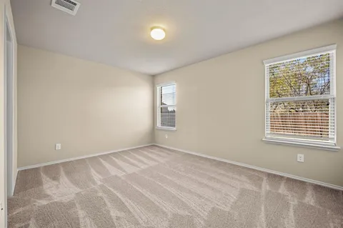 a bathroom with a shower sink and mirror