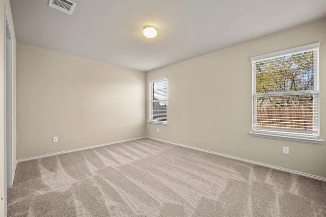 a bathroom with a shower sink and mirror
