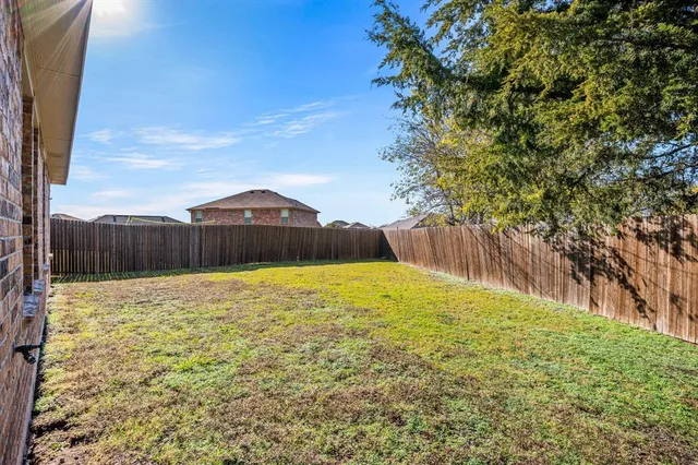 a large kitchen with stainless steel appliances granite countertop a stove and a sink