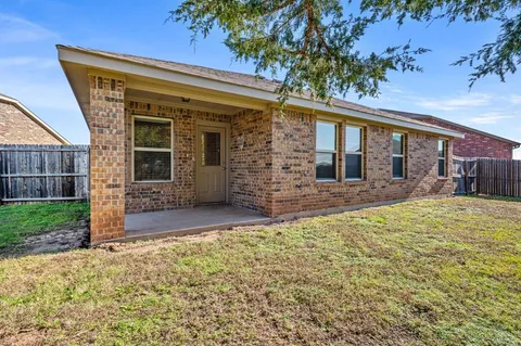 front view of a house with a large window