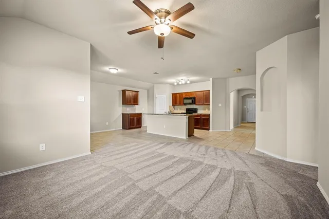 a view of a kitchen with a sink and a refrigerator