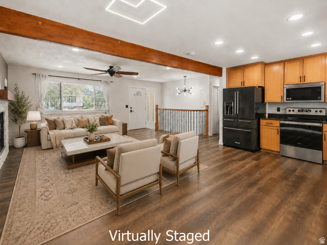 2693 Teal Way Sandy, UT 84093 - Photo 3 of 50 Open-concept living space featuring wood-finish flooring, exposed ceiling beams, recessed lighting, and a window allowing for natural light