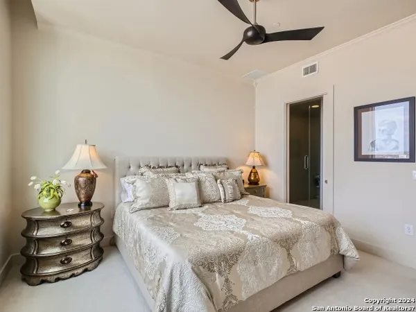 a bedroom with a bed and a dresser