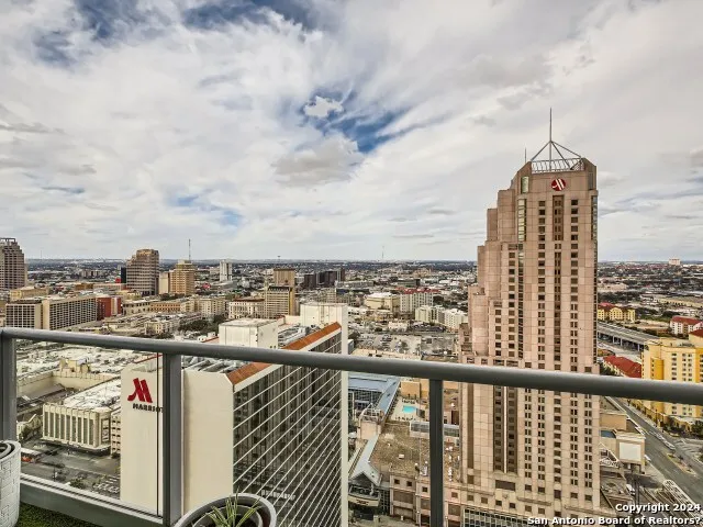 a view of a balcony with city view