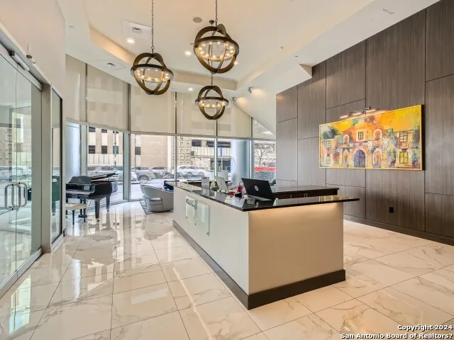 a kitchen with stainless steel appliances kitchen island granite countertop a stove a sink and a microwave