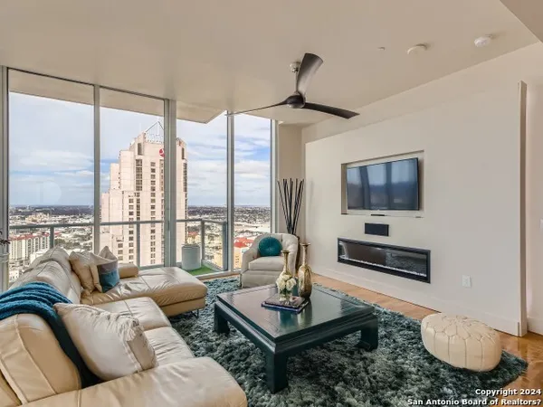 a living room with furniture and a flat screen tv