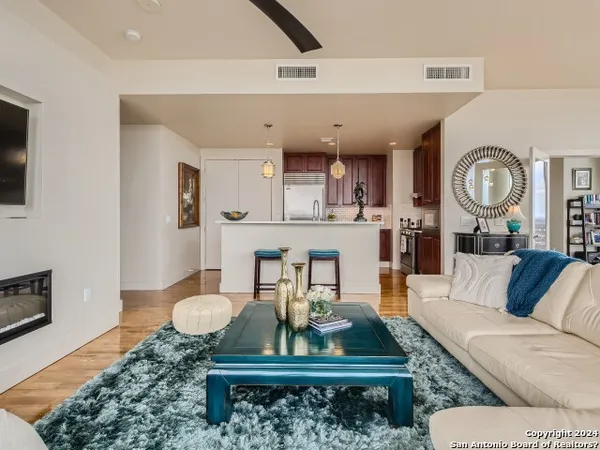a living room with a couch and a fireplace