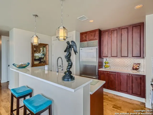 a kitchen with a sink cabinets and window