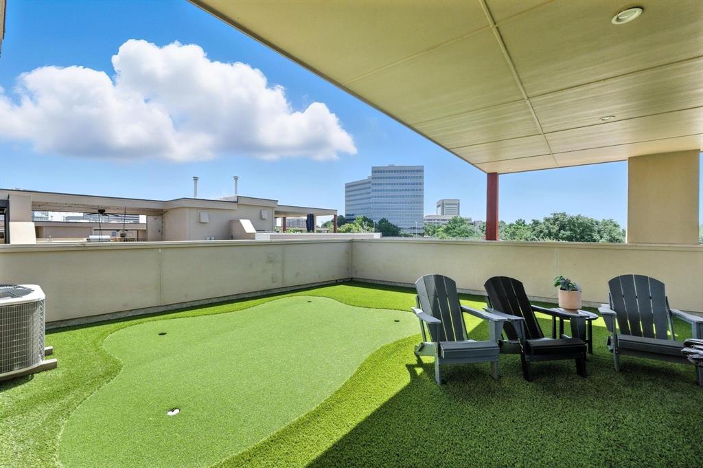 101 Decker Drive, Unit 301 Irving, TX 75062 - Photo 1 of 32 a view of a swimming pool and chairs in the patio