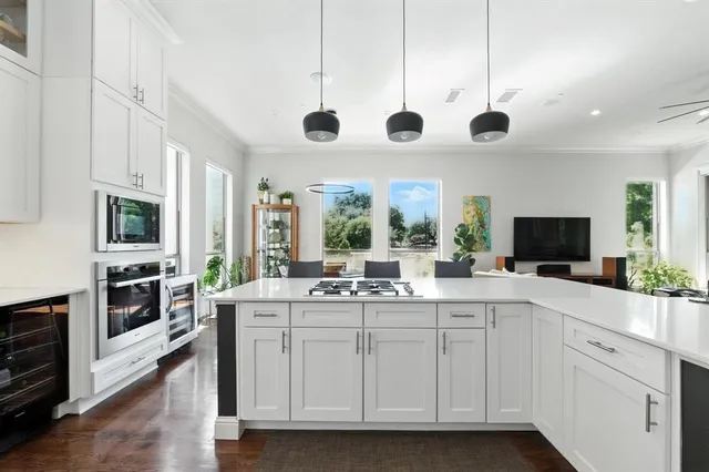 a kitchen with a stove a sink and a refrigerator