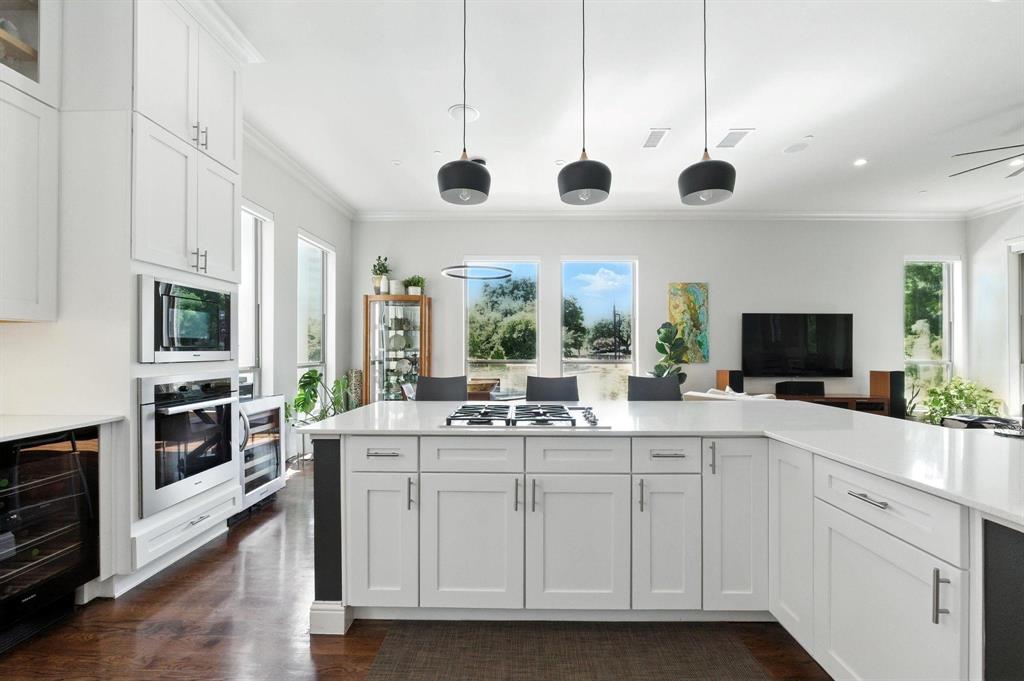 101 Decker Drive, Unit 301 Irving, TX 75062 - Photo 14 of 32 a kitchen with a stove a sink and a refrigerator