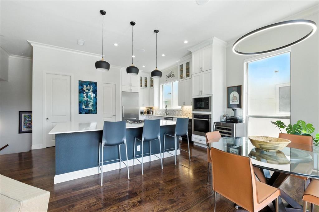 101 Decker Drive, Unit 301 Irving, TX 75062 - Photo 18 of 32 a large kitchen with a table and chairs