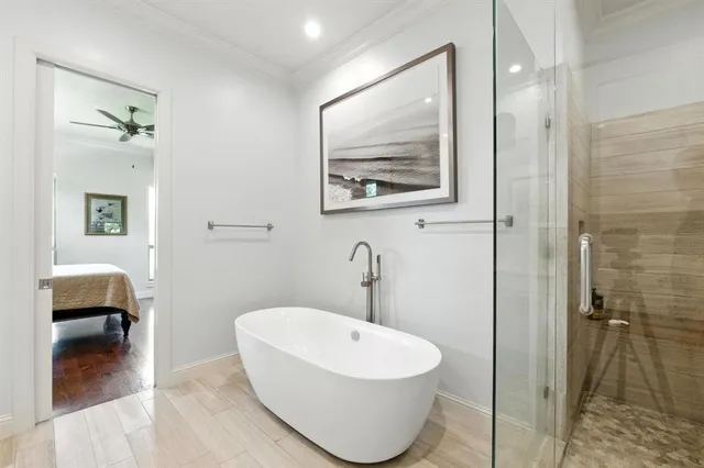 a bathroom with a toilet and a mirror