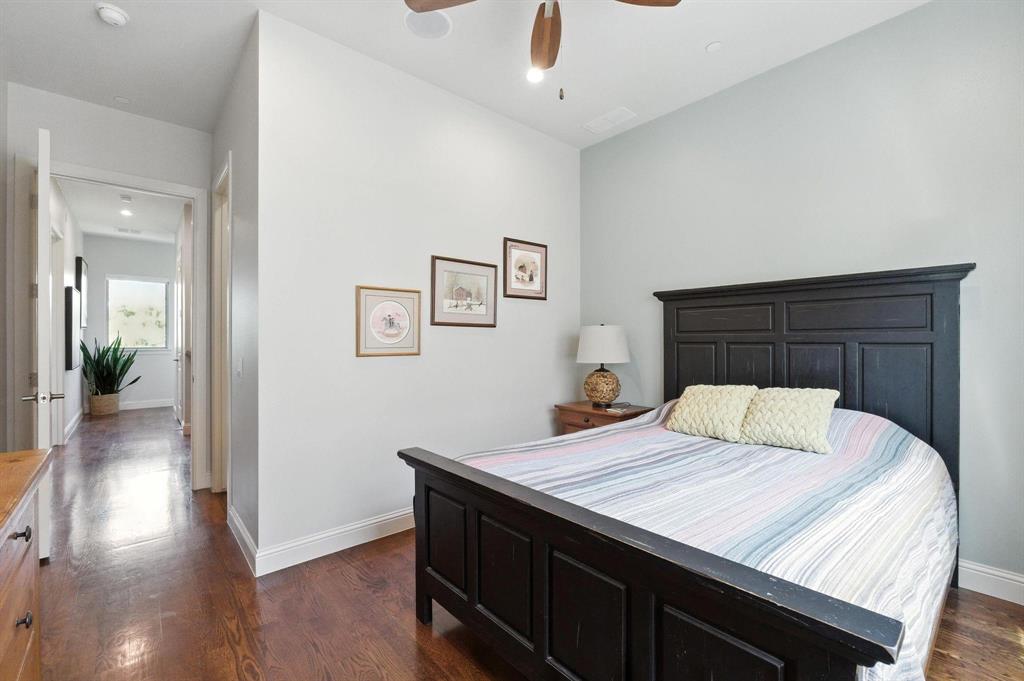 101 Decker Drive, Unit 301 Irving, TX 75062 - Photo 28 of 32 a room with a bed and a wooden floor