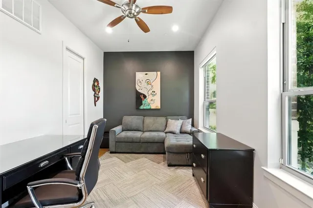 a living room with furniture and a window
