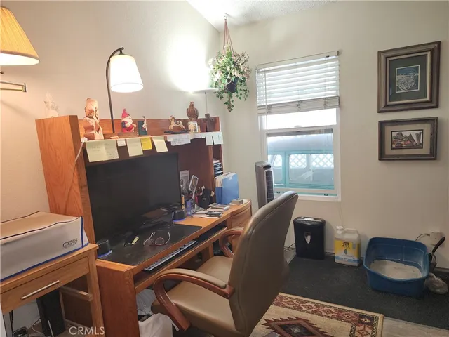 a bed room with a bed and a chair