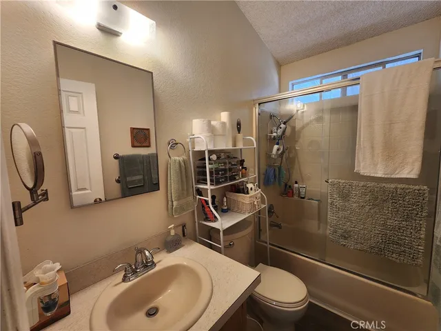 a view of a chandelier in a hallway