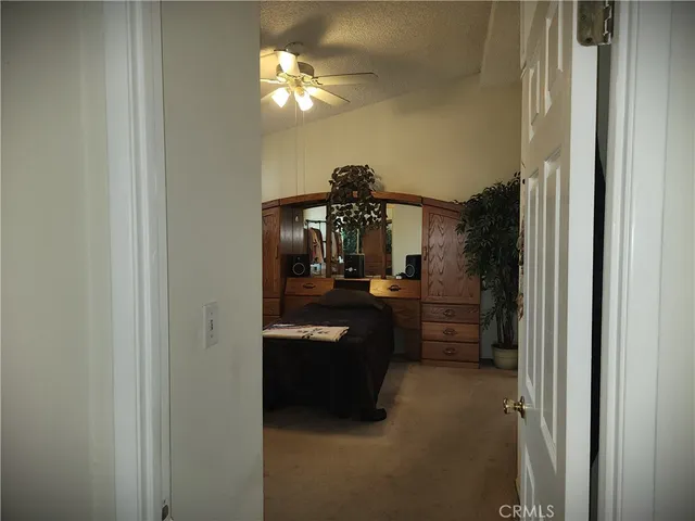 a very nice looking room with a large bed and a chandelier