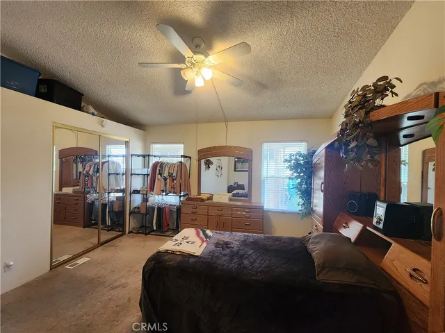 a bathroom with a sink vanity mirror and toilet