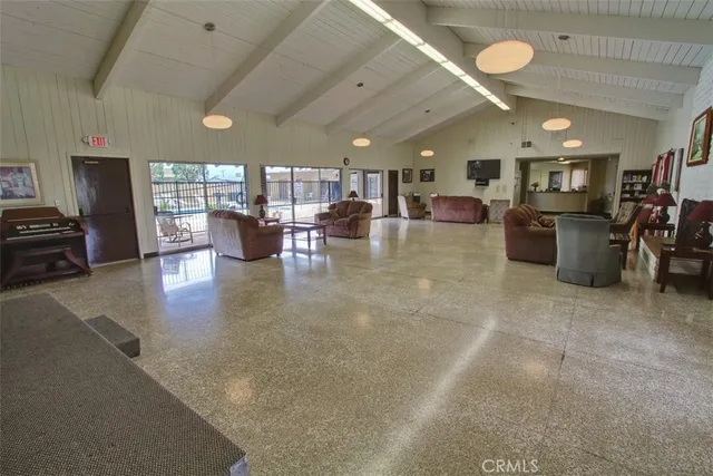 a view of a swimming pool with an outdoor seating and a lake view