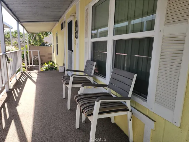 a view of living room with furniture and floor to ceiling window