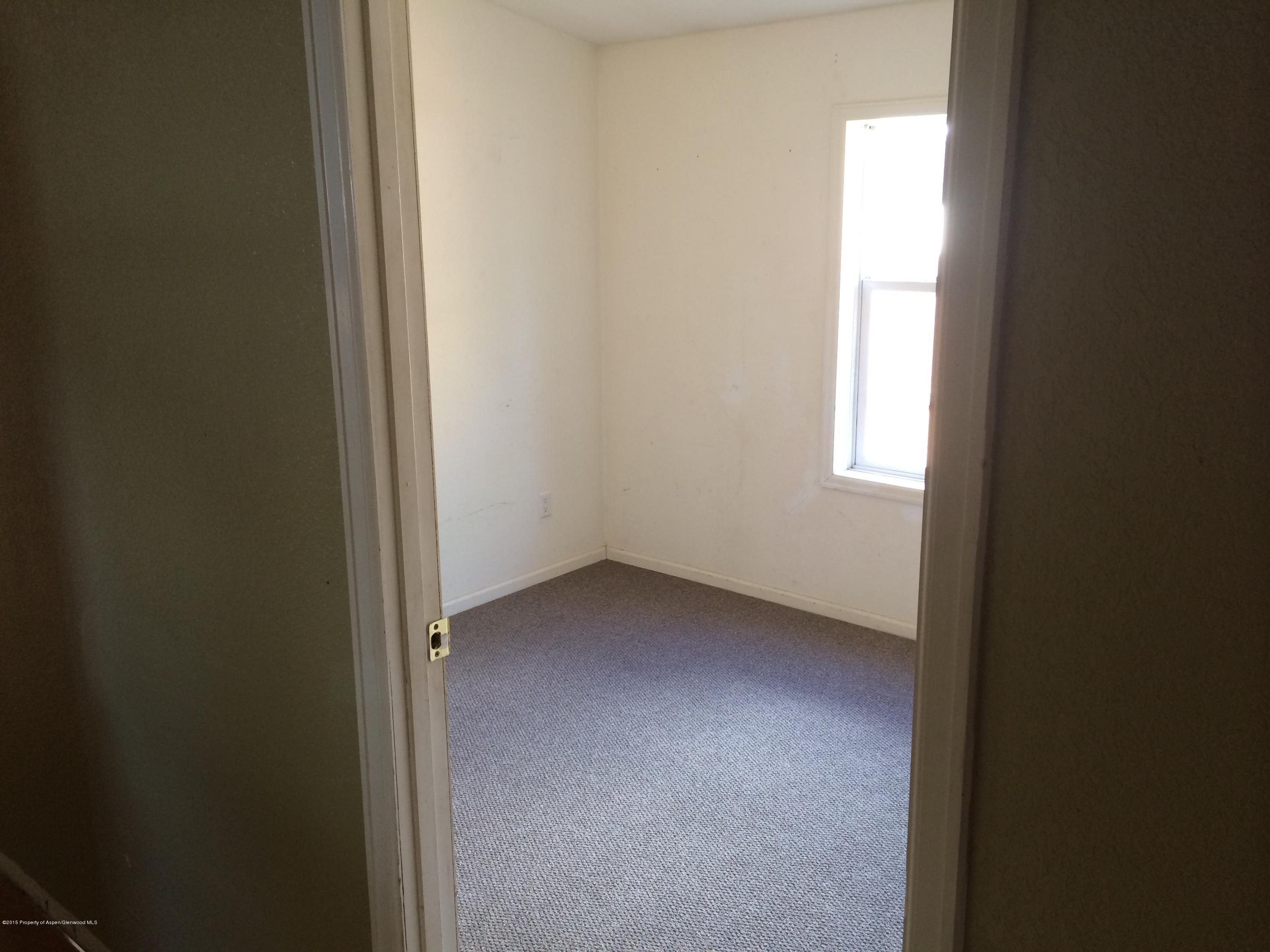 140 Ray Street Rifle, CO 81650 - Photo 8 of 11 a view of an empty room and a window