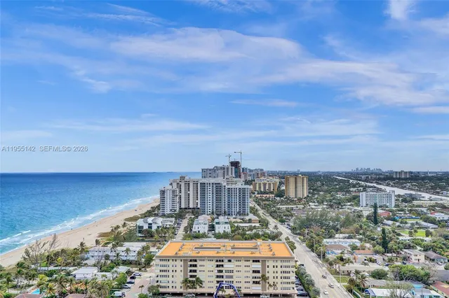 a view of a livingroom with furniture window and wooden floor