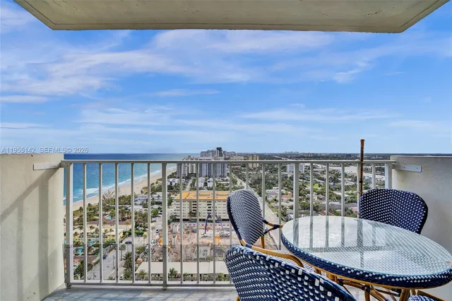 a dining room with furniture and a view of kitchen