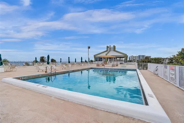 a view of a dining room with furniture and window