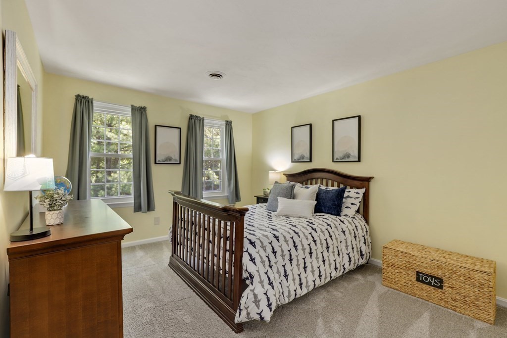72 Nixon Road Framingham, MA 01701 - Photo 34 of 42 a bedroom with a bed and lamp with window