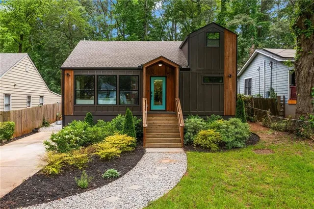 a front view of a house with garden