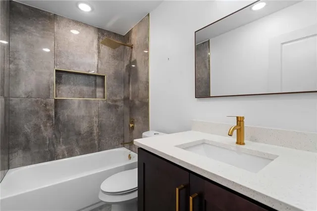 an empty room with fan and windows